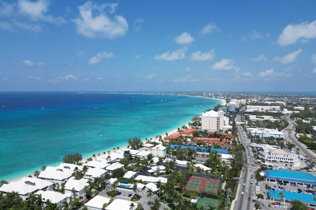 Shot of Seven Mile Beach, Grand Cayman, The Cayman Islands from above showing crystal clear waters that offshore lawyers experience during their offshore legal careers