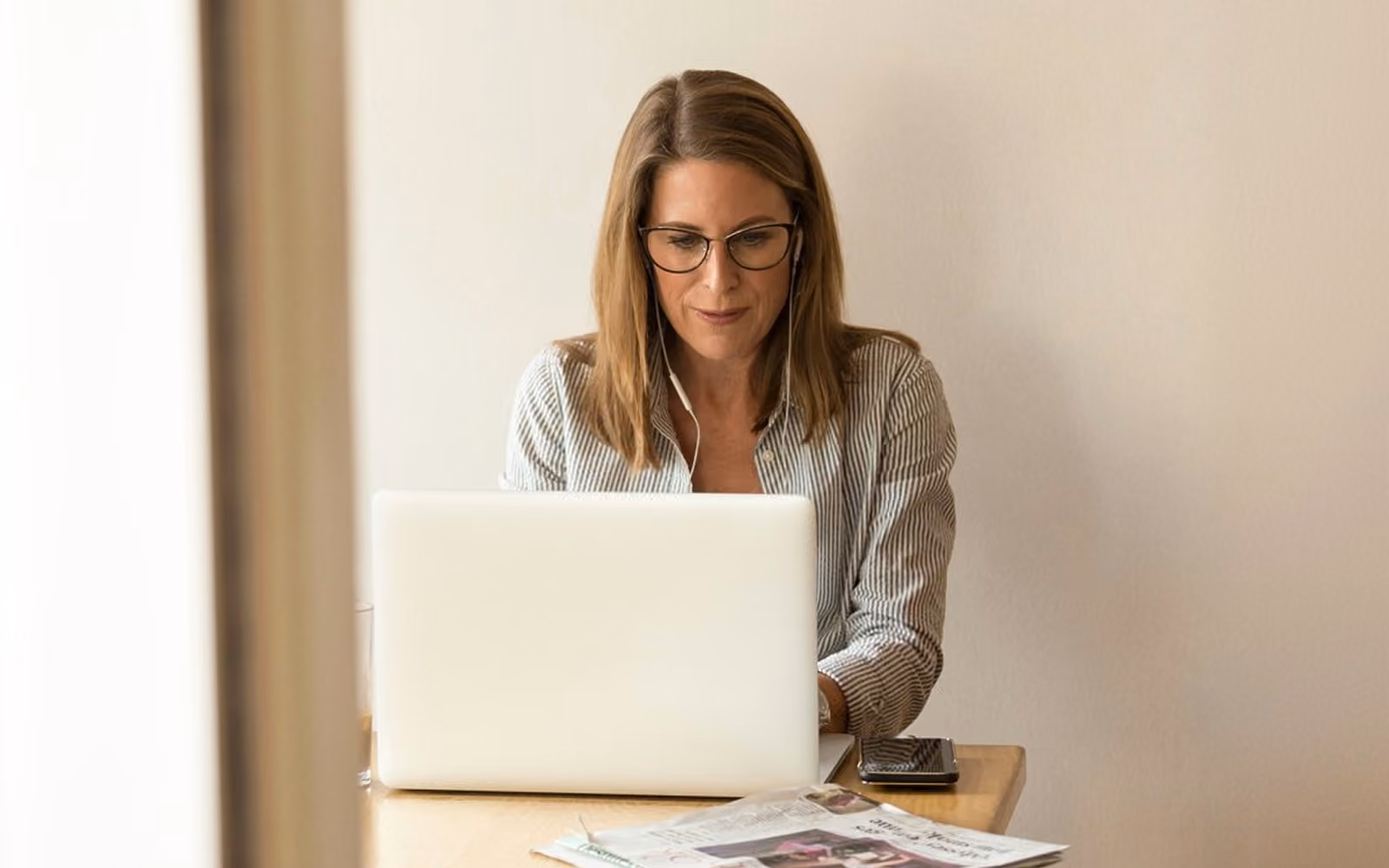 Clinician focused on her laptop