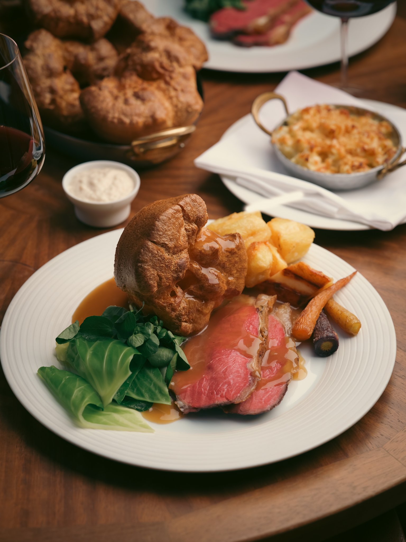 sunday roast meal at dining table