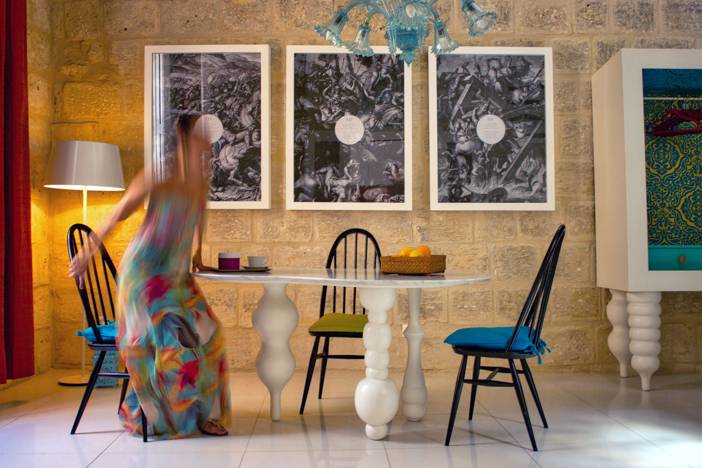 The Dining Room in this exclusive house for sale in Malta shows a bespoke Carrara marble table and a theatrical wardrobe with matching legs. 