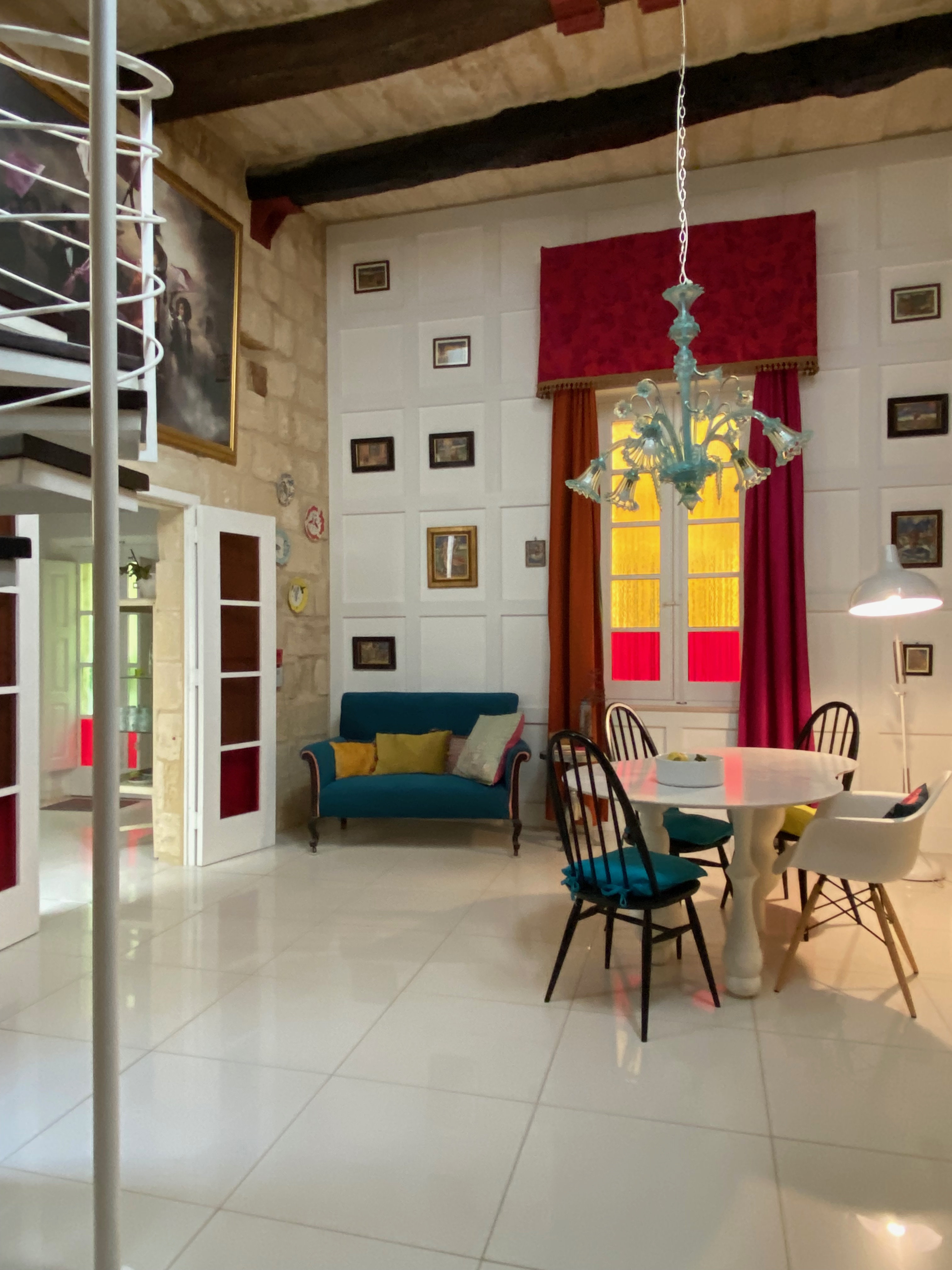 Malta house for sale's high ceiling dining room with panelled wall