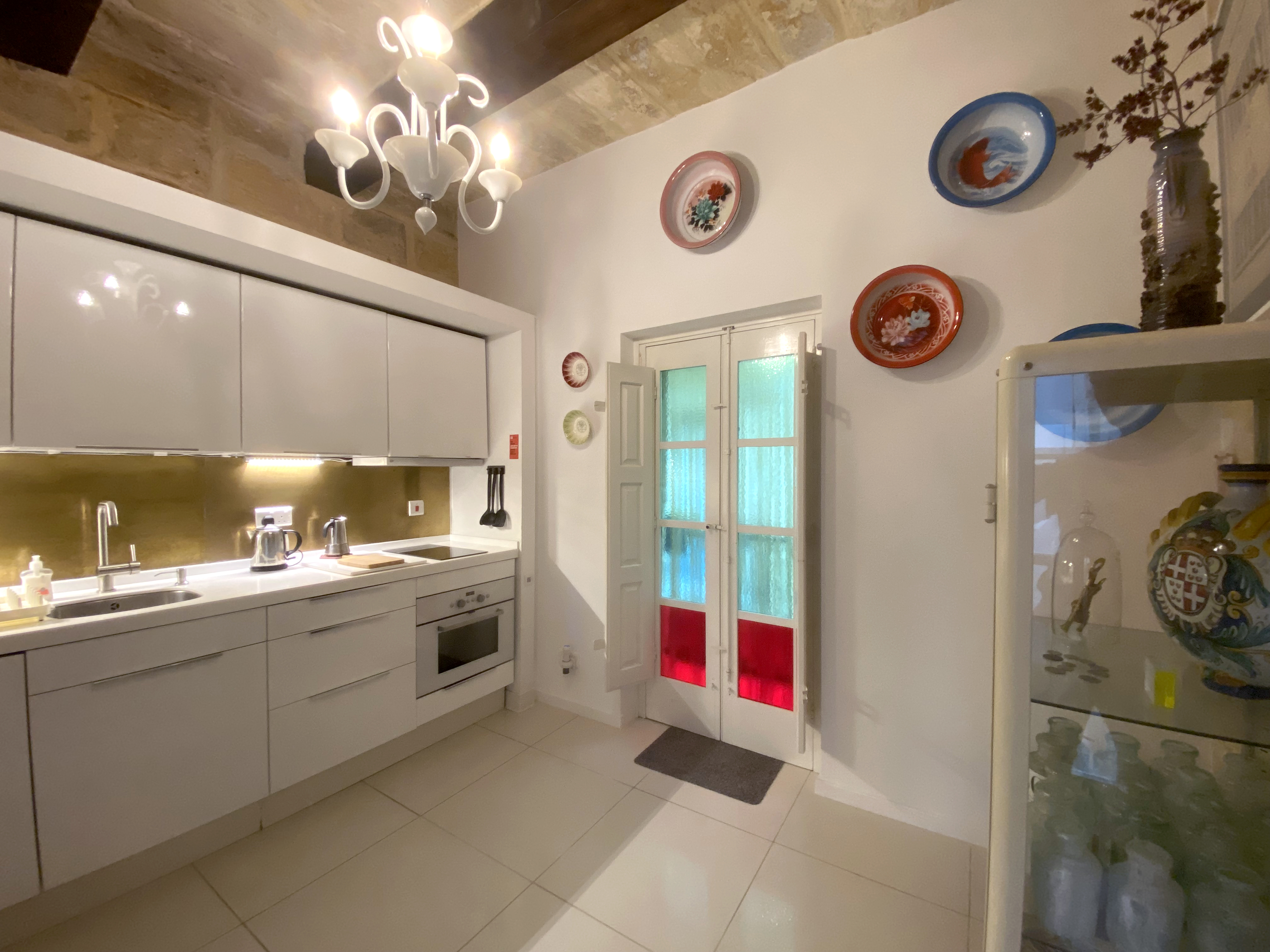 Kitchen with brass splashback. Sale property with separate kitchen. Malta passport