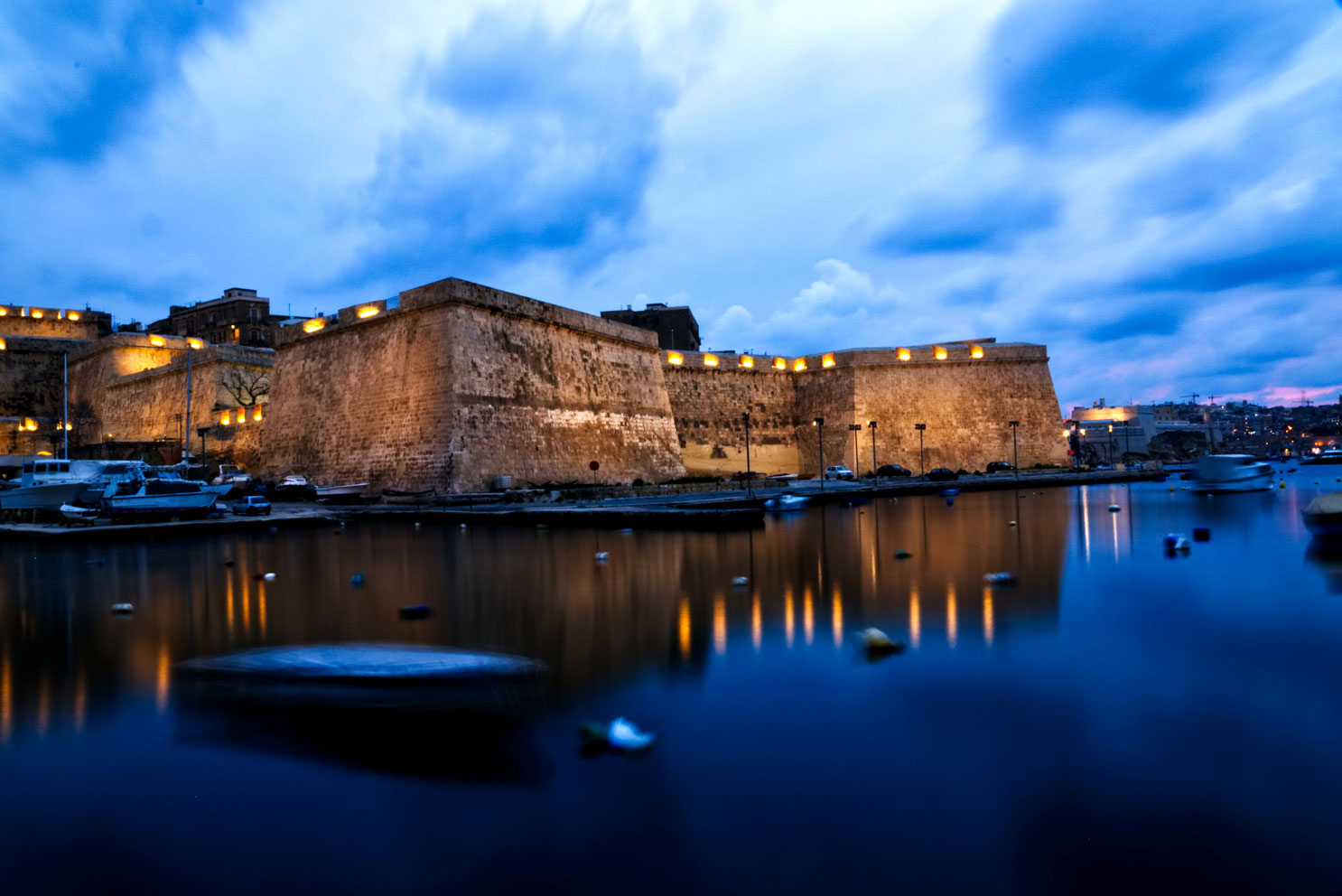 Vittoriosa Birgu fortifications see from the sea. Malta historic house for sale.