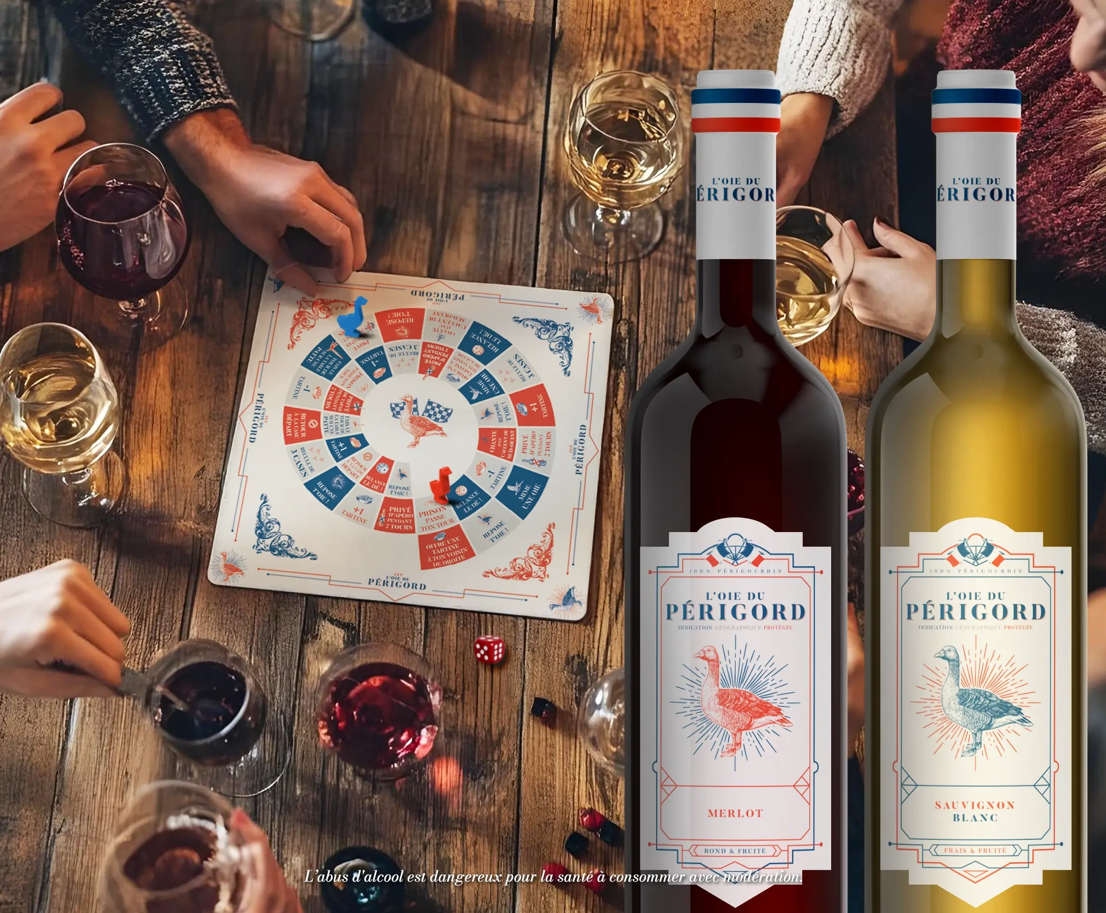 2 bouteilles de vin en premier plan et en second plan une table avec un jeu de l'oie et des verres de vin