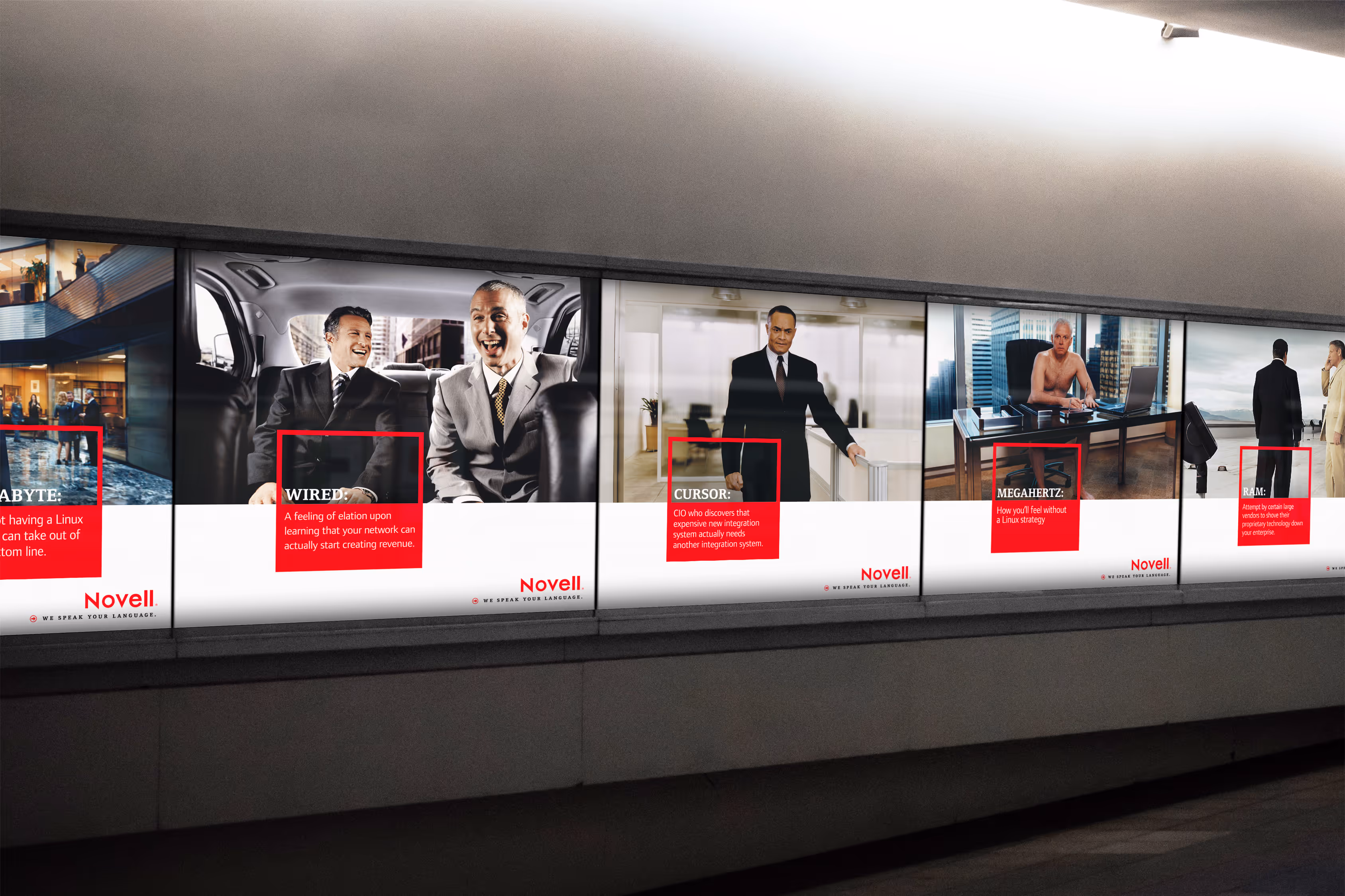Series of Novell posters illuminated at an airport.