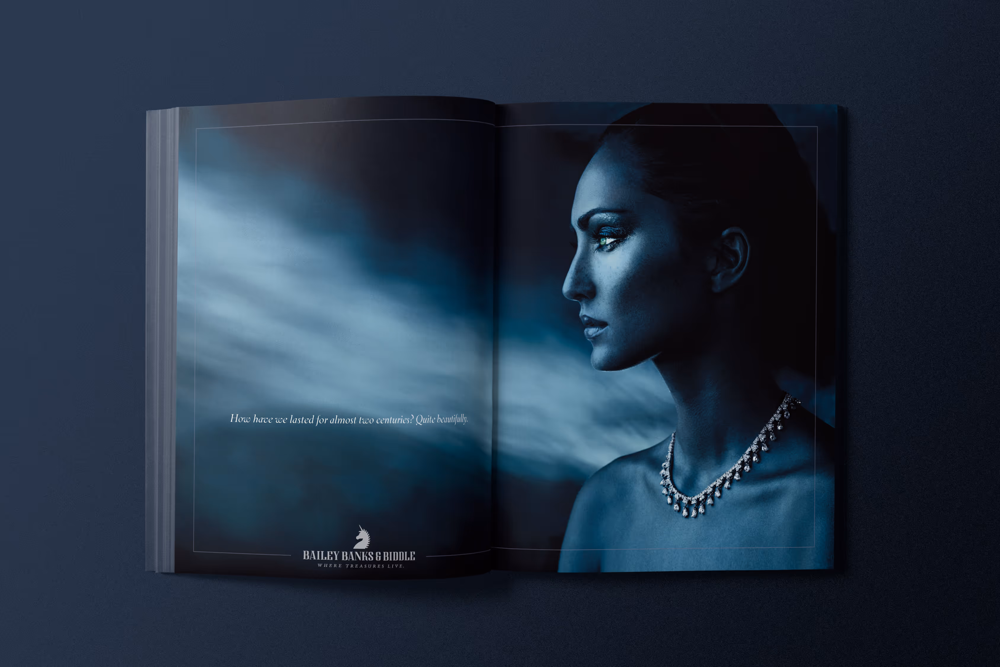 Magazine spread for Bailey, Banks & Biddle. Stylized blue to highlight the jewelry on a model. A gold briole necklace.