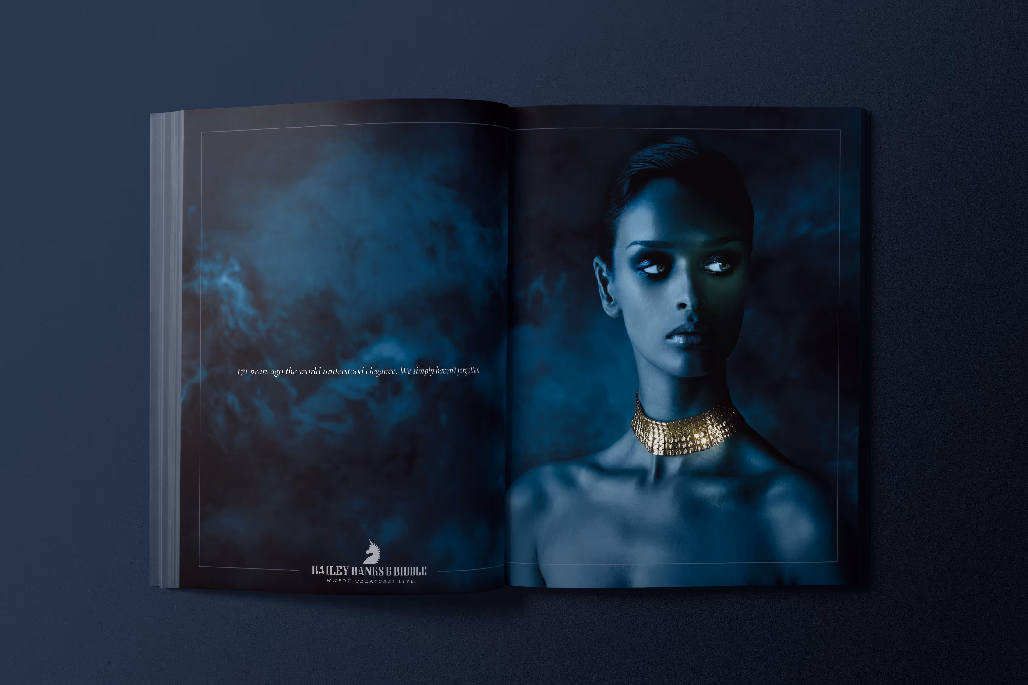 Magazine spread for Bailey, Banks & Biddle. Stylized blue to highlight the jewelry on a model. A gold choker.