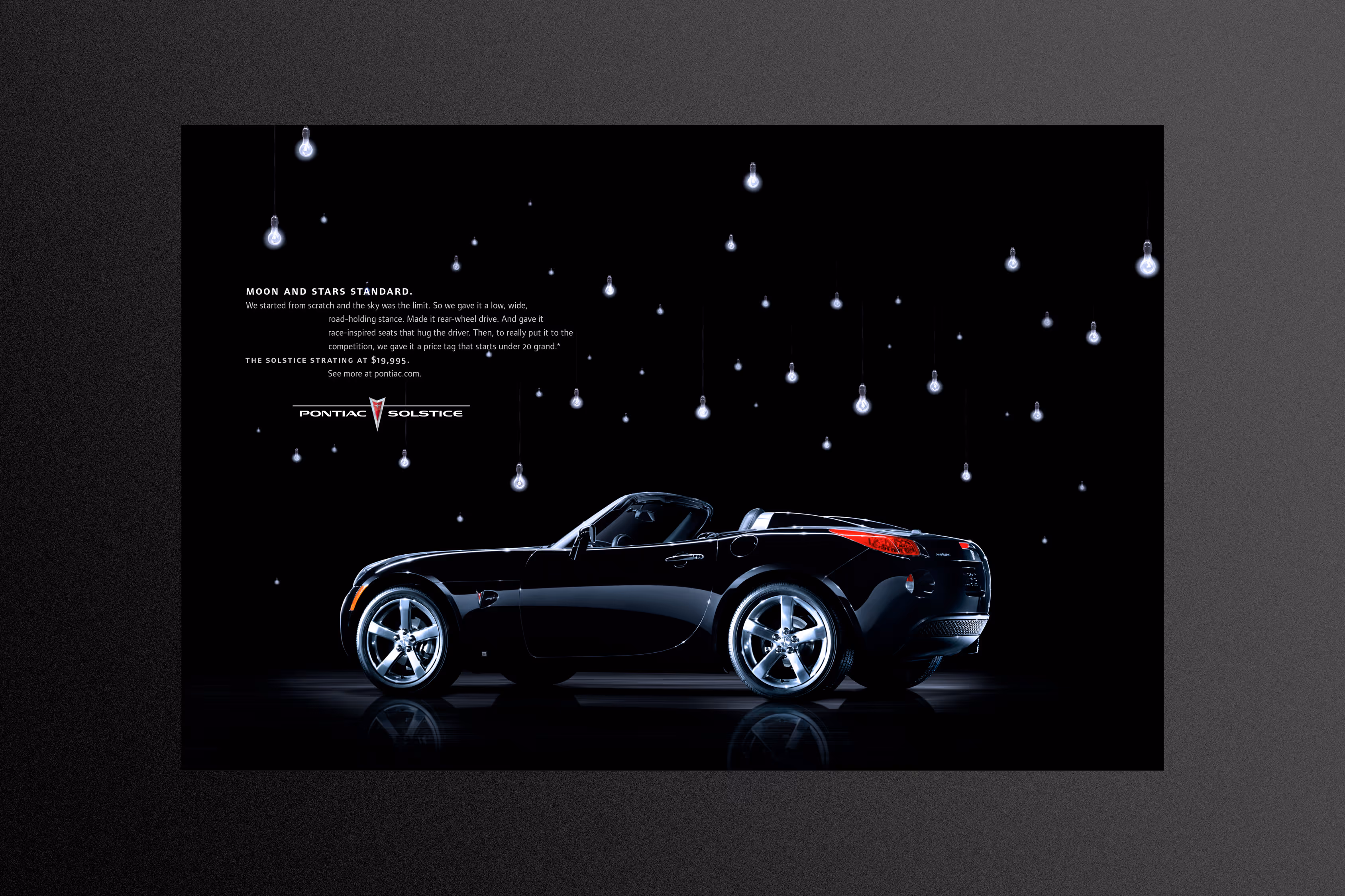 Pontiac Solstice illuminated by a multitude of house lights to look like stars.