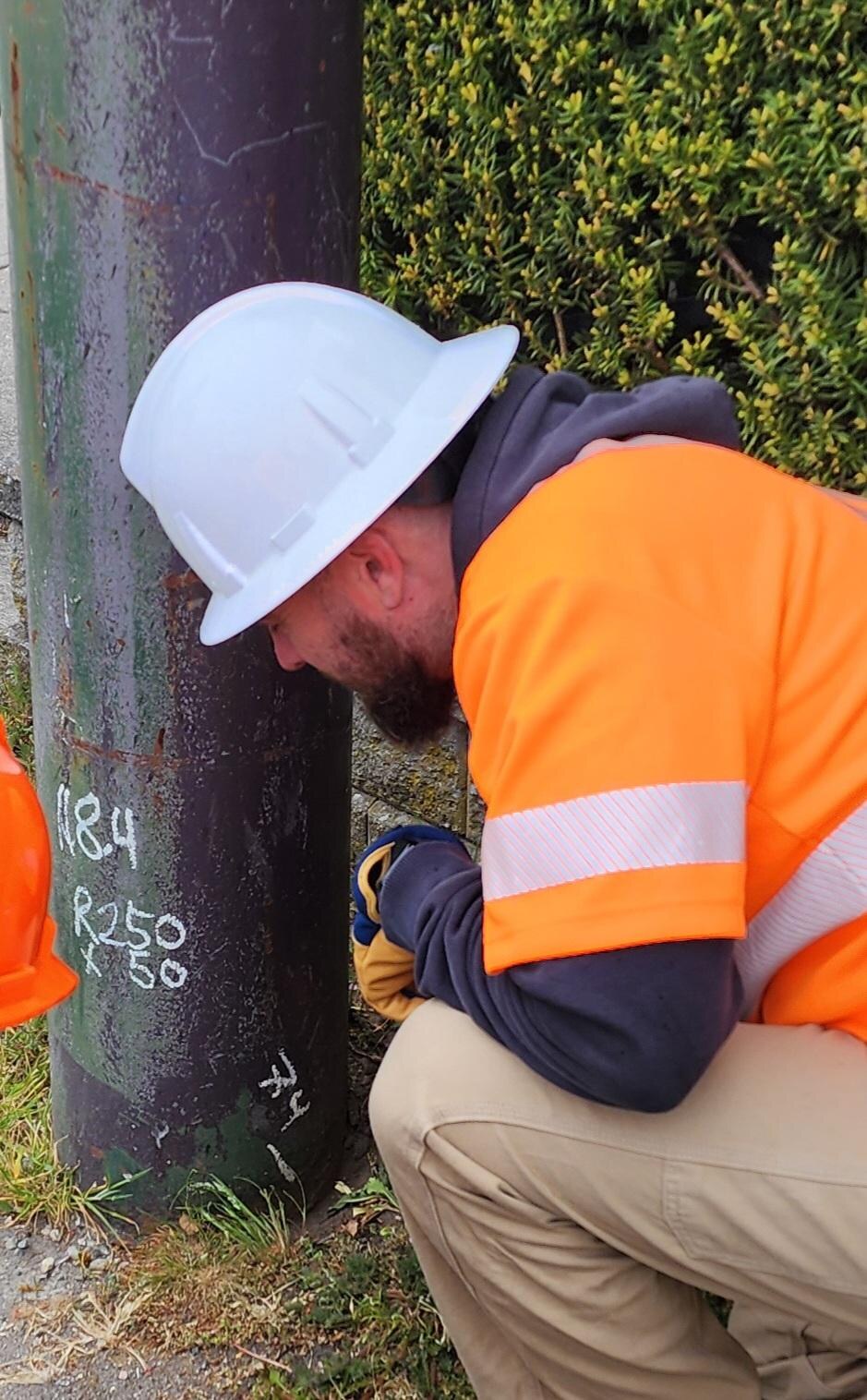 Streetlight pole review for defects, access, and safety.