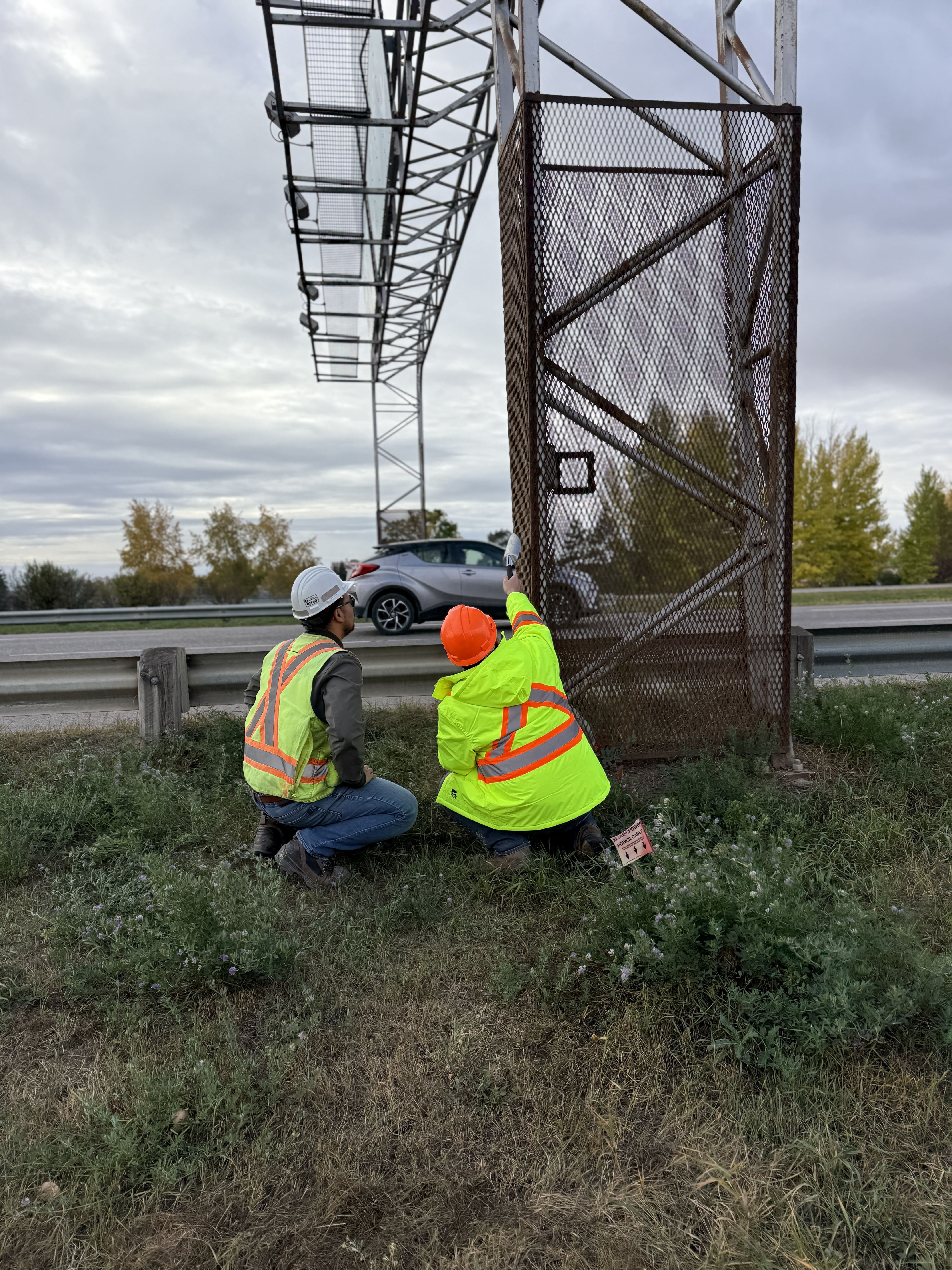 Overhead truss base survey for bracing and foundation condition.