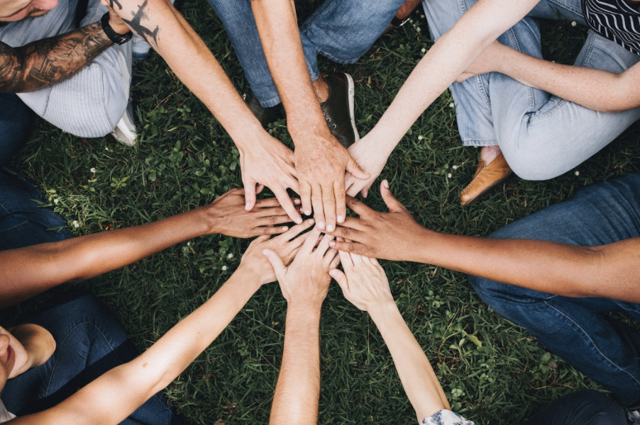 holding hands in grass