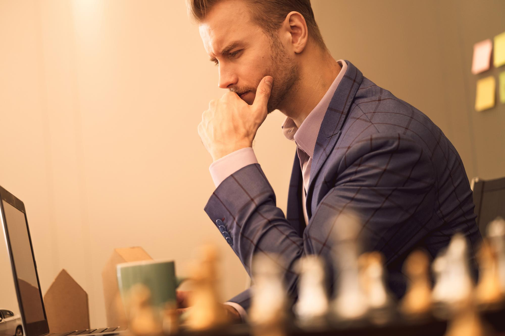 a man thinking with checkers