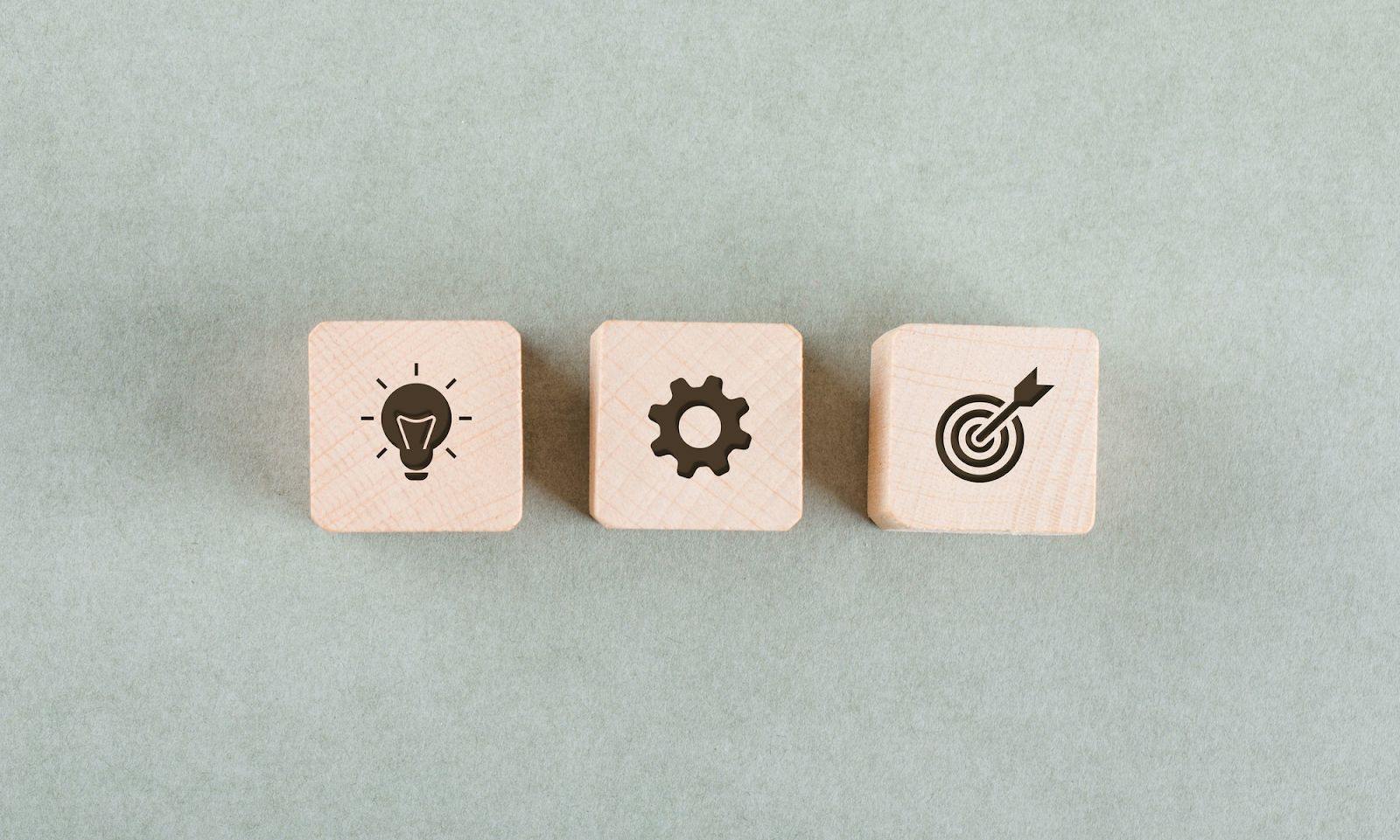 grey background and three dices with icons 