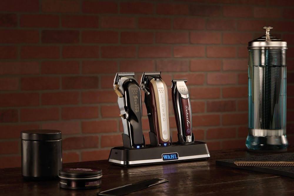 Wahl hair clippers and trimmers arranged on a barber's counter.