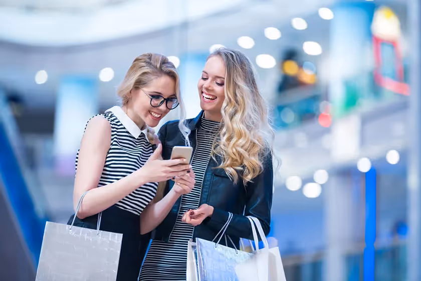 happy customers looking at phone