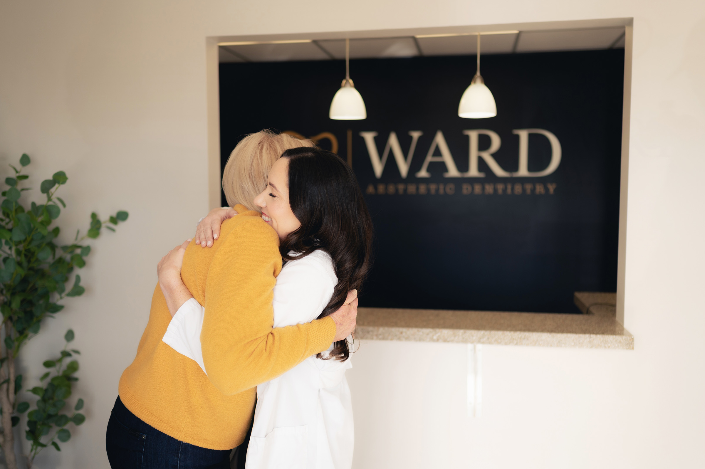 Dr. Ward hugging a patient 