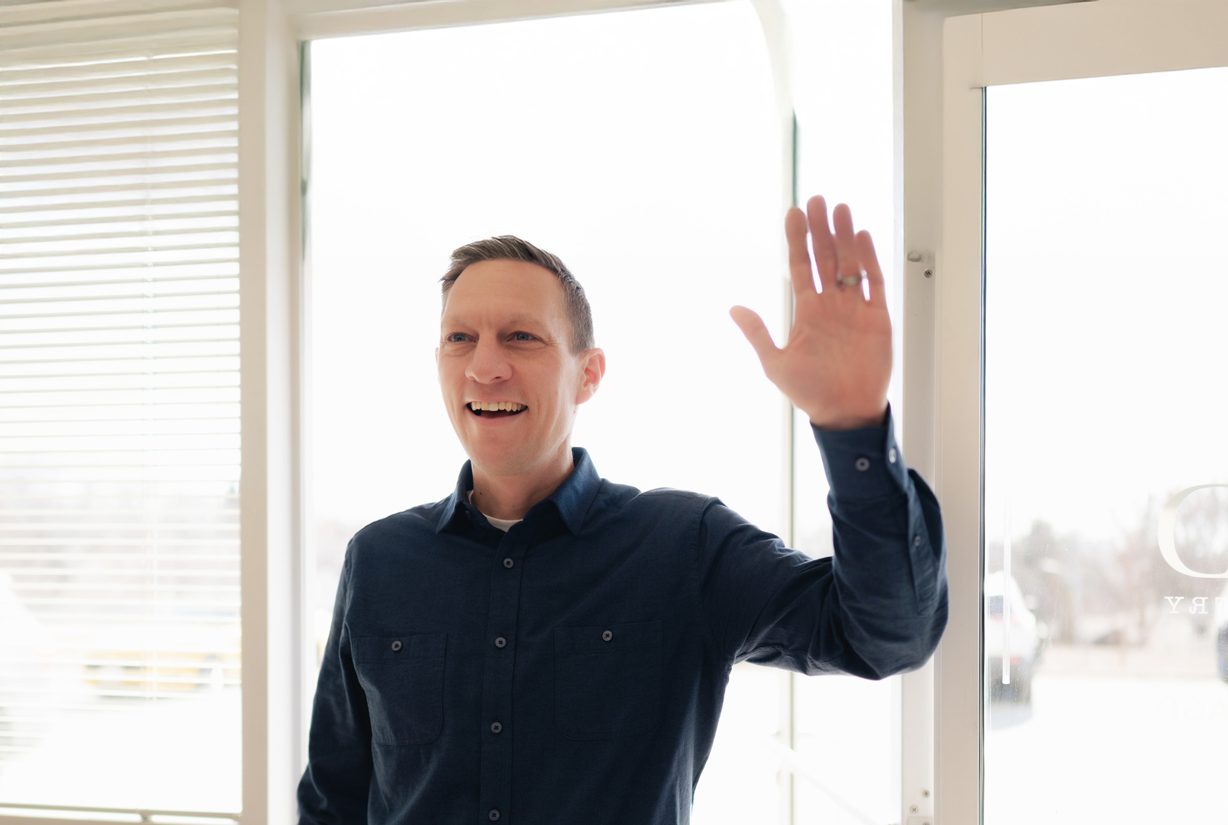 Photo of a male patient waving