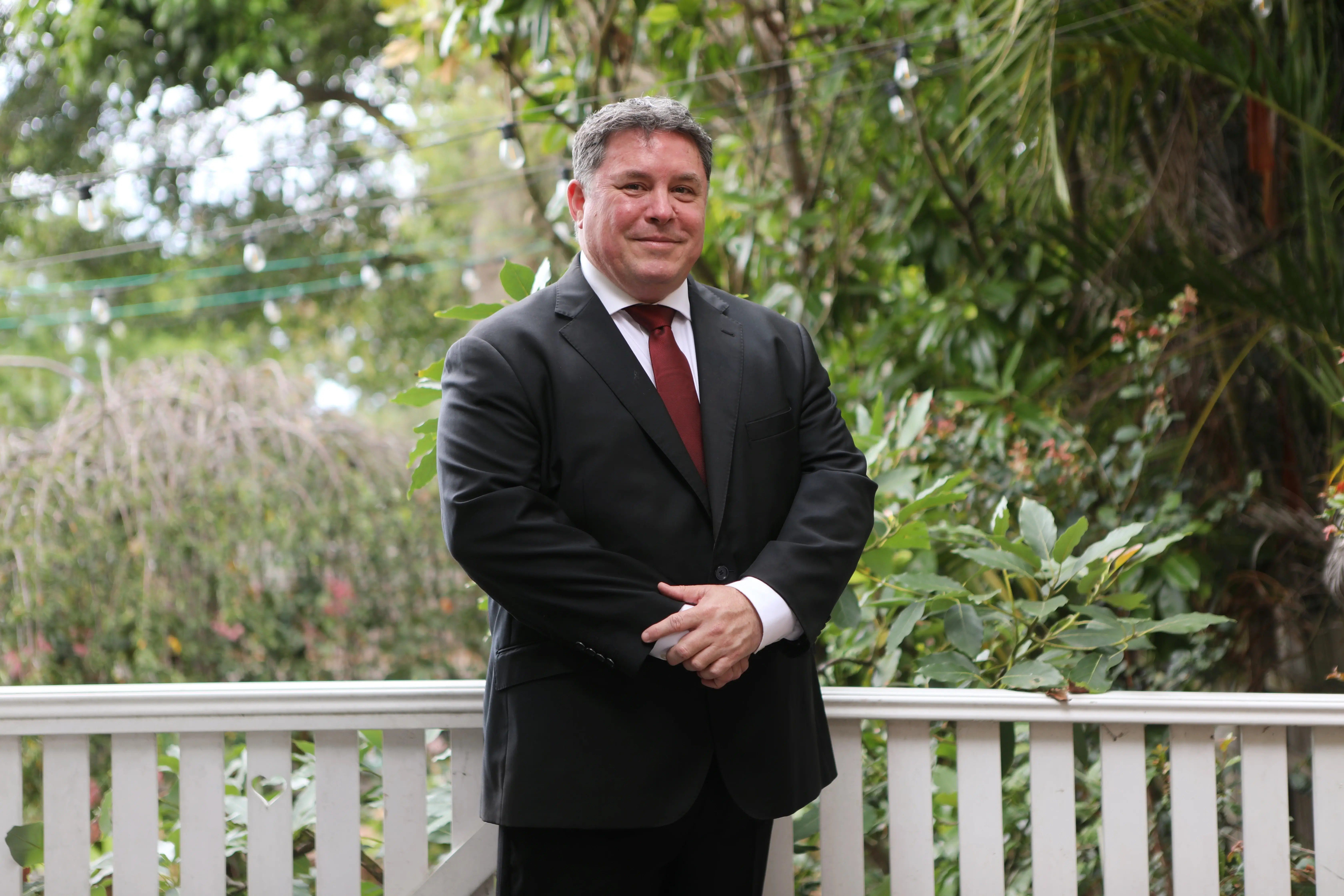 Portrait of David, part of the Ambrose Australia team, standing with a warm smile.