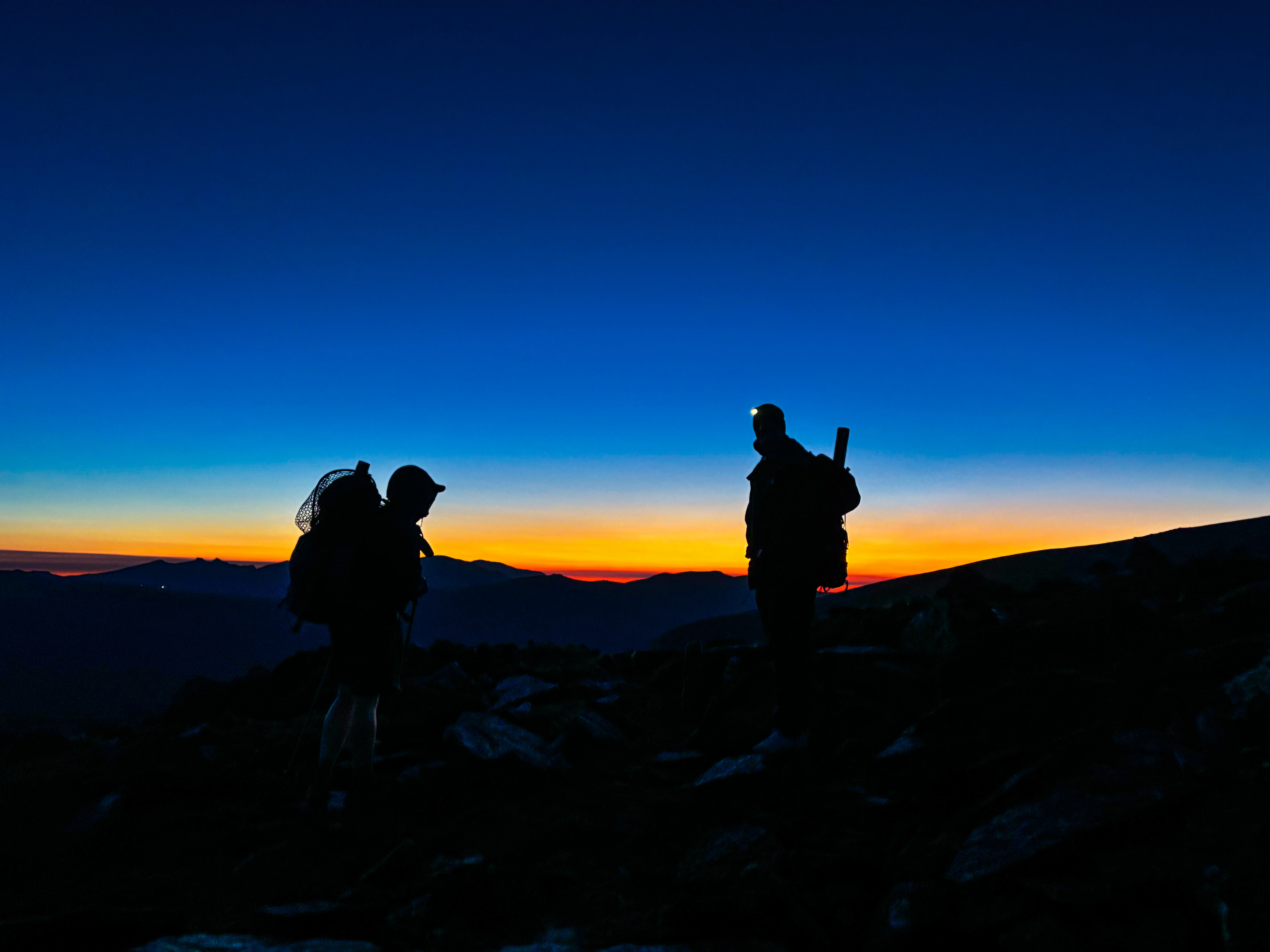 A brief break as the two fly fisherman gaze upon the rising sun