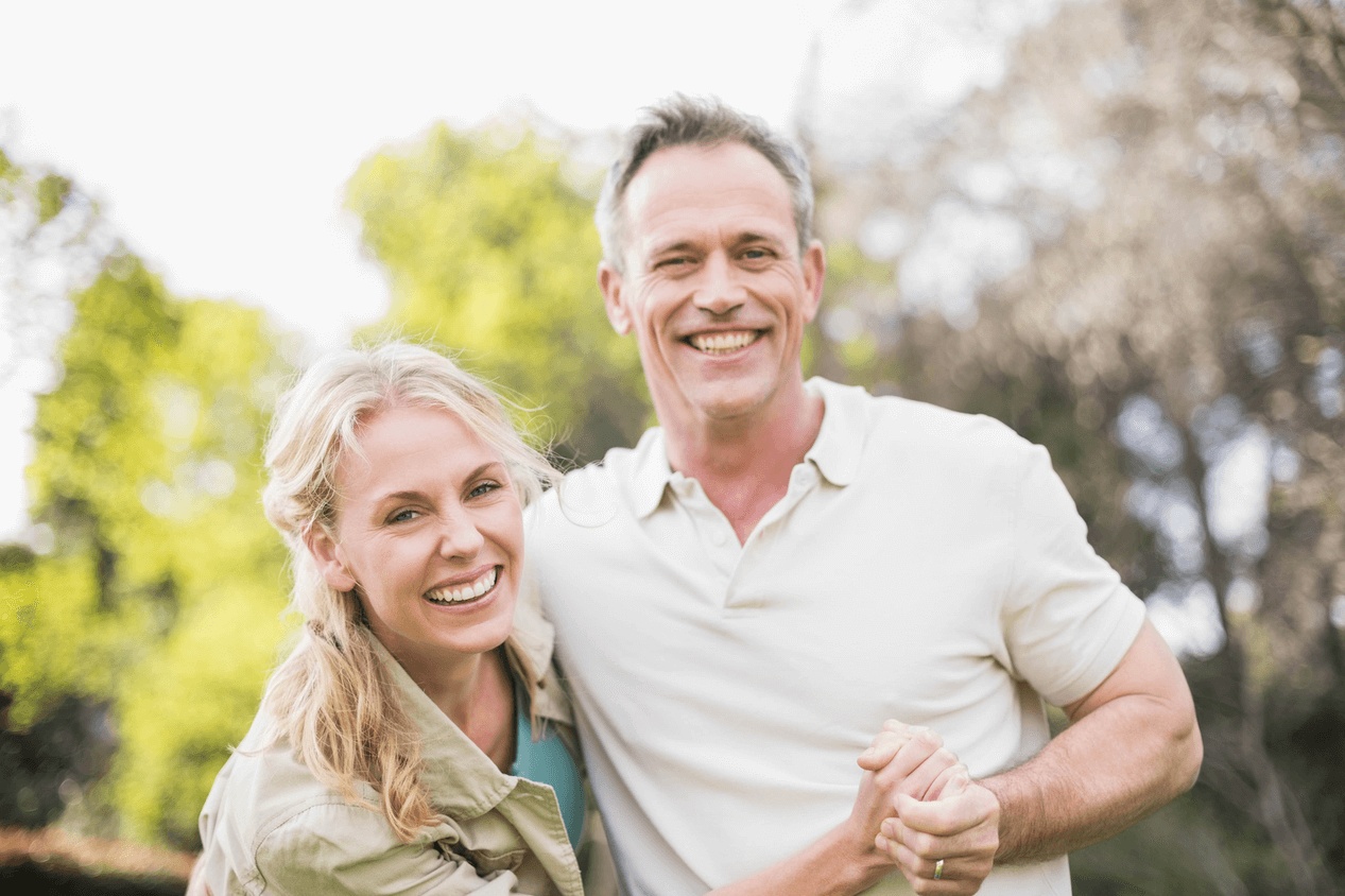 Smiling seniors enjoying time outdoors, showcasing healthy teeth supported by preventive care from the best dentist in Berkeley.