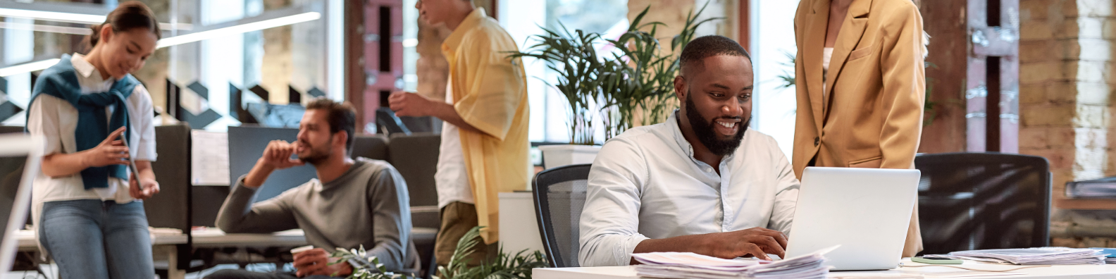 Diverse team working together in a modern, bright office space