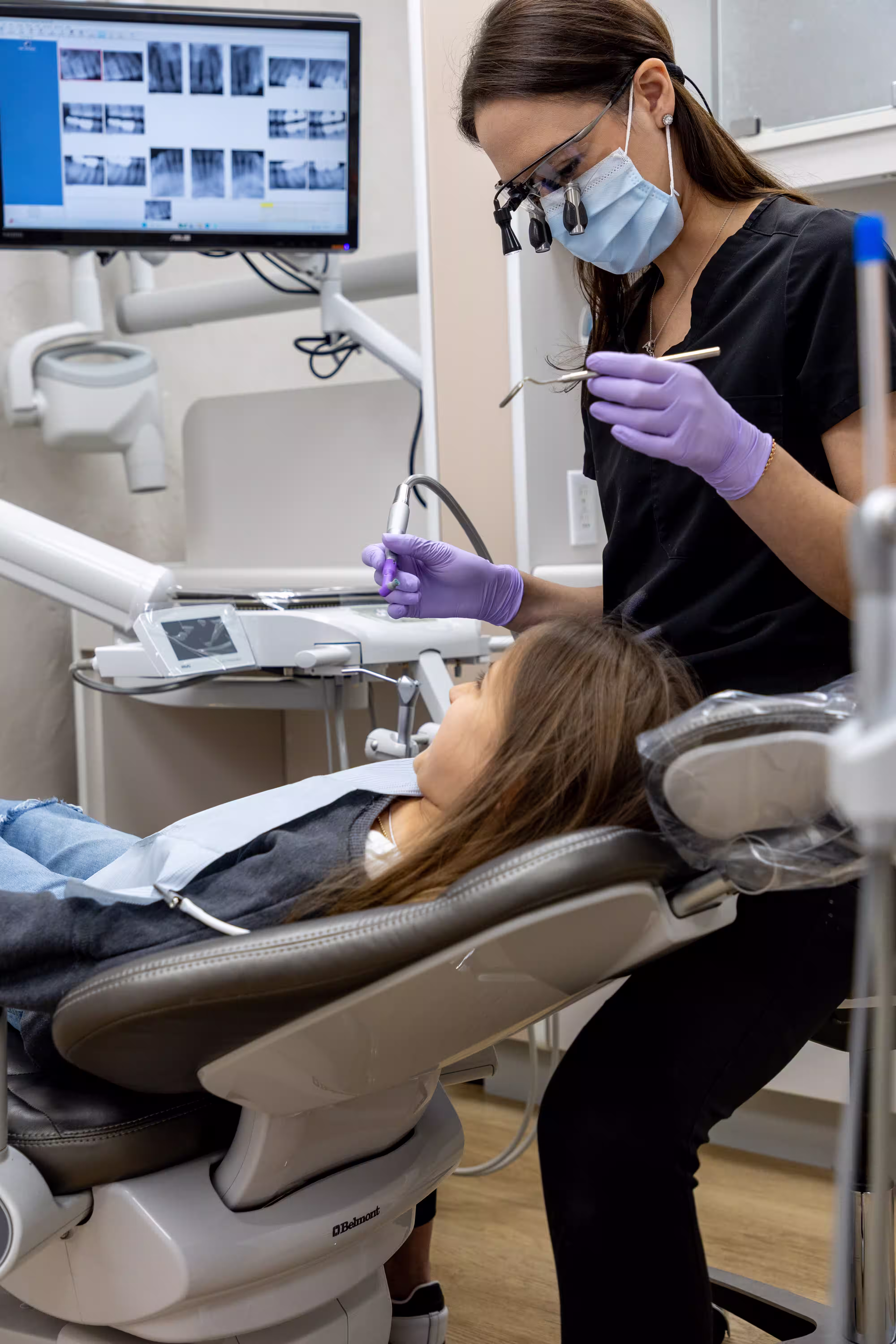 Smiling little girl in dentist chair