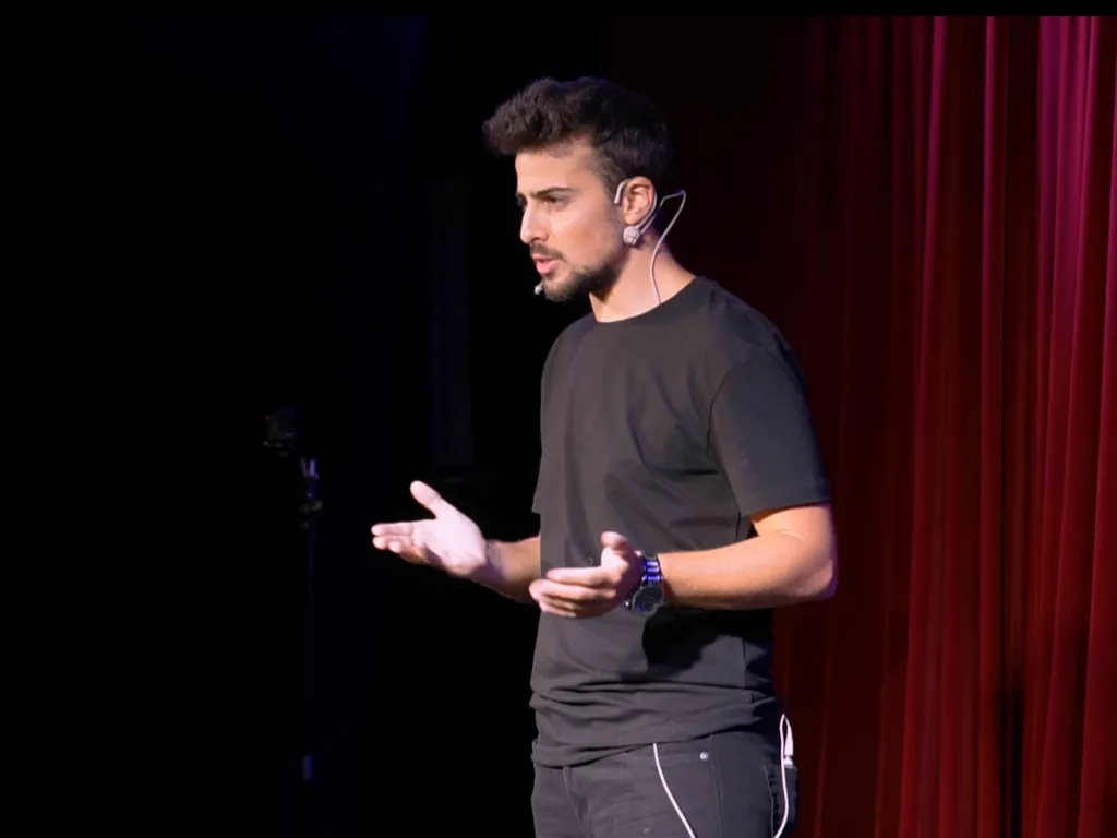 photo of a previous talk of Michael on a stage
