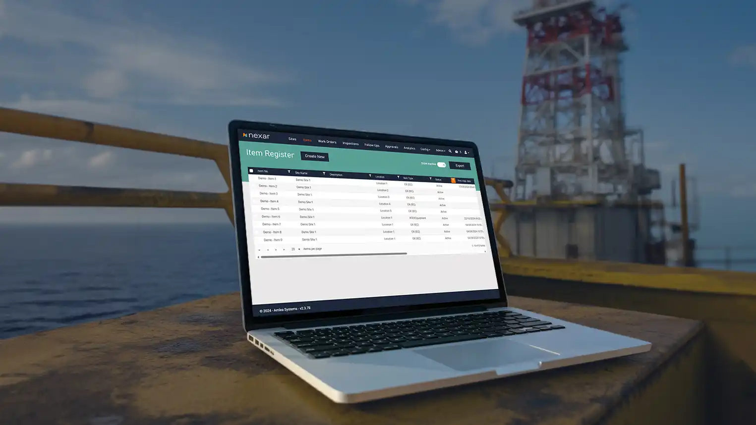 A laptop displaying Nexar inspection software on an offshore oil platform, with the sea and rig in the background.