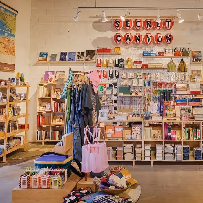 Mojave Flea trading post interior with books, clothing, gifts, and artisan goods on display.