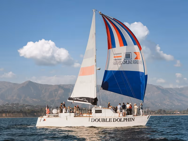 Double Dolphin catamaran sailing with colorful Santa Barbara Sailing Center