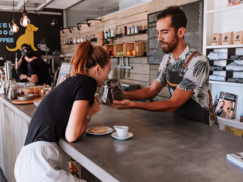 Baristas preparing specialty coffee drinks behind the bar at Coffee Lab in San Jose del Cabo