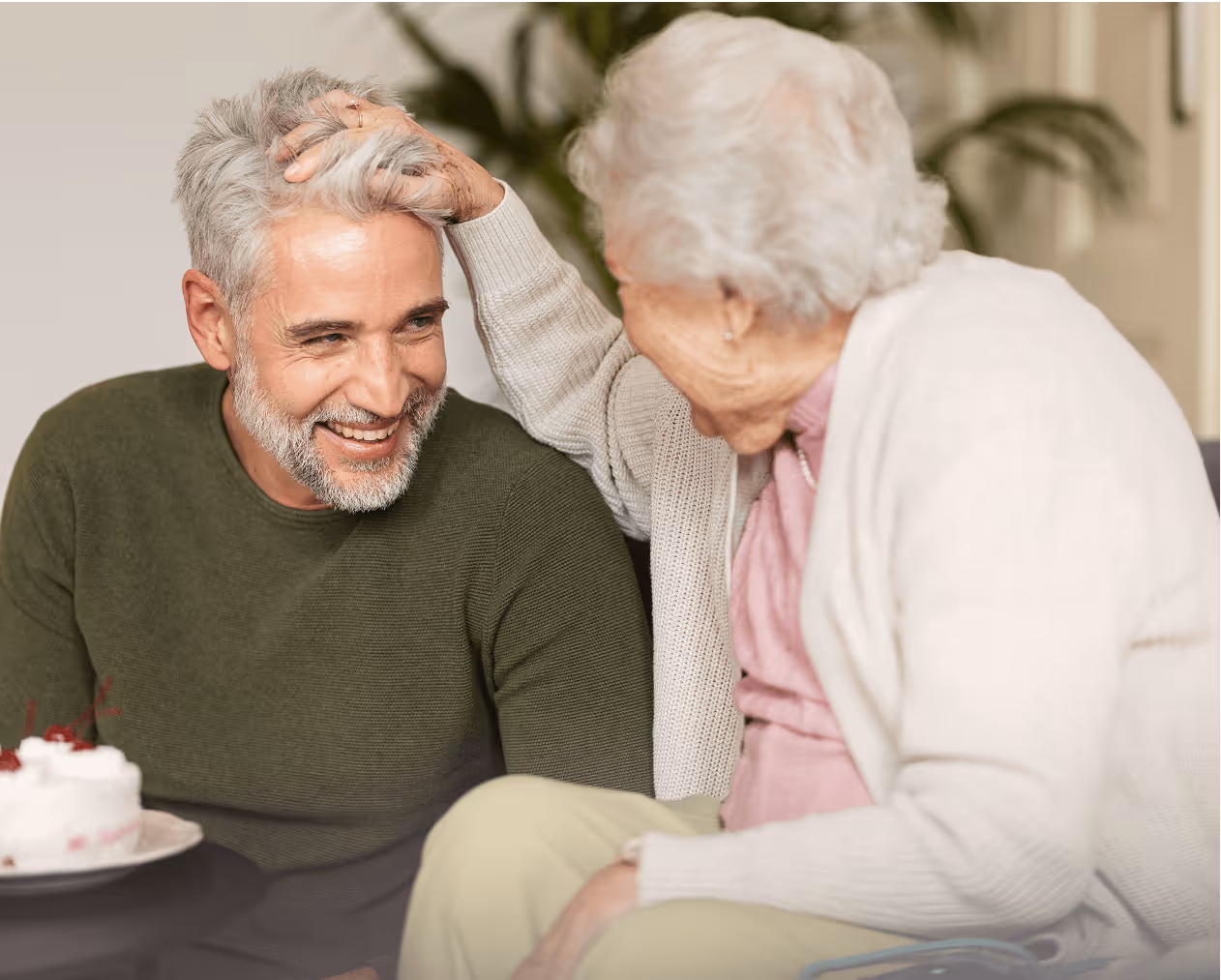 Smiling mother and adult son spending quality time together