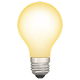 A glowing yellow light bulb on a gray background.