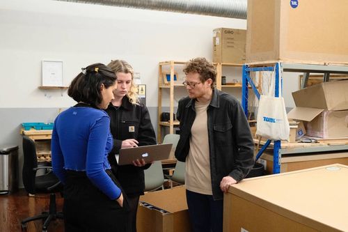 TUNL team working in warehouse to help solve customer queries