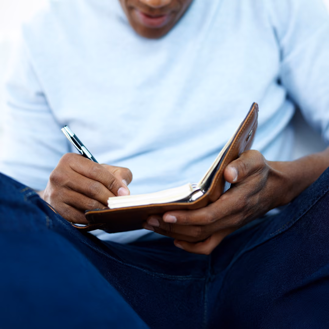 A patient works on integration of their ketamine experience through journaling in a notebook. 