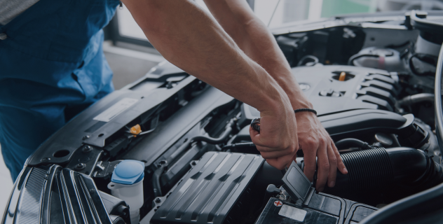 Experienced employee checking an engine