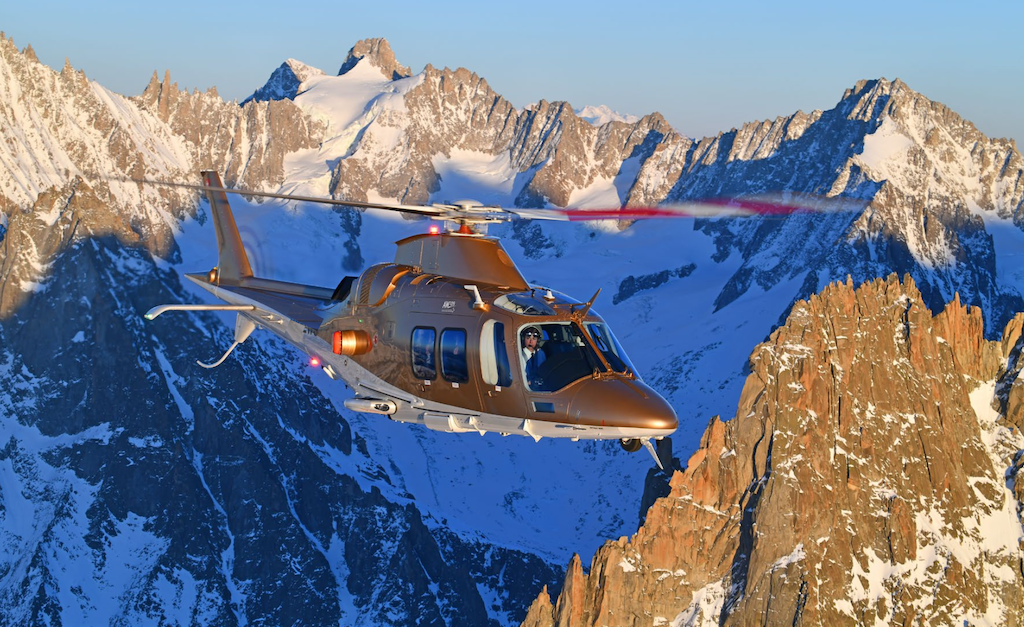 2021 Agusta AW109 Grand New in flight over the swiss alps