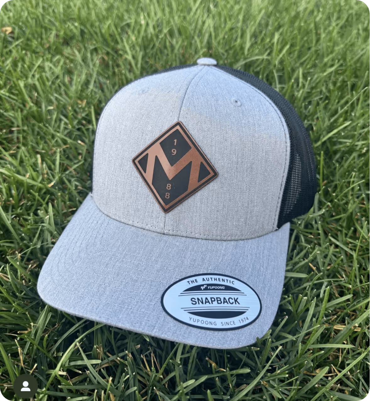 Snapback hat with leather logo of the McCordsville badge designed by AP The Creative. 