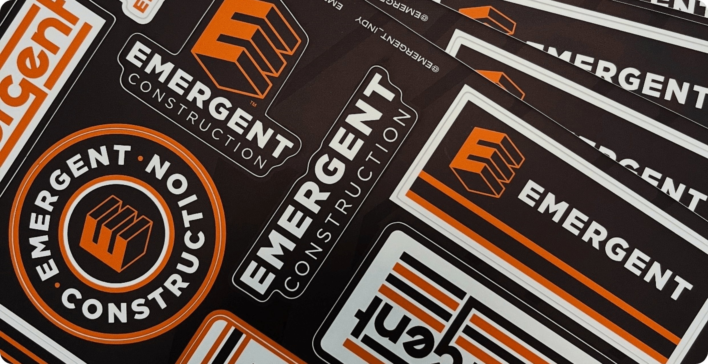 Branded sticker sheets for Emergent Construction in Indiana designed by AP The Creative.