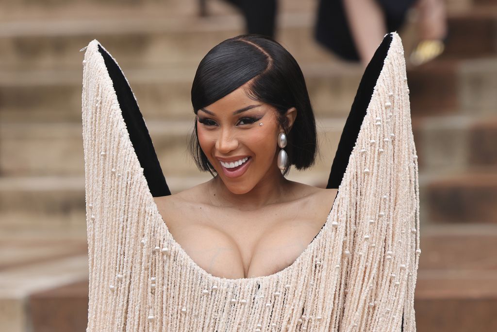 Image may contain Cardi B Head Person Face Happy Smile Black Hair Hair Photography Portrait Adult and Wedding