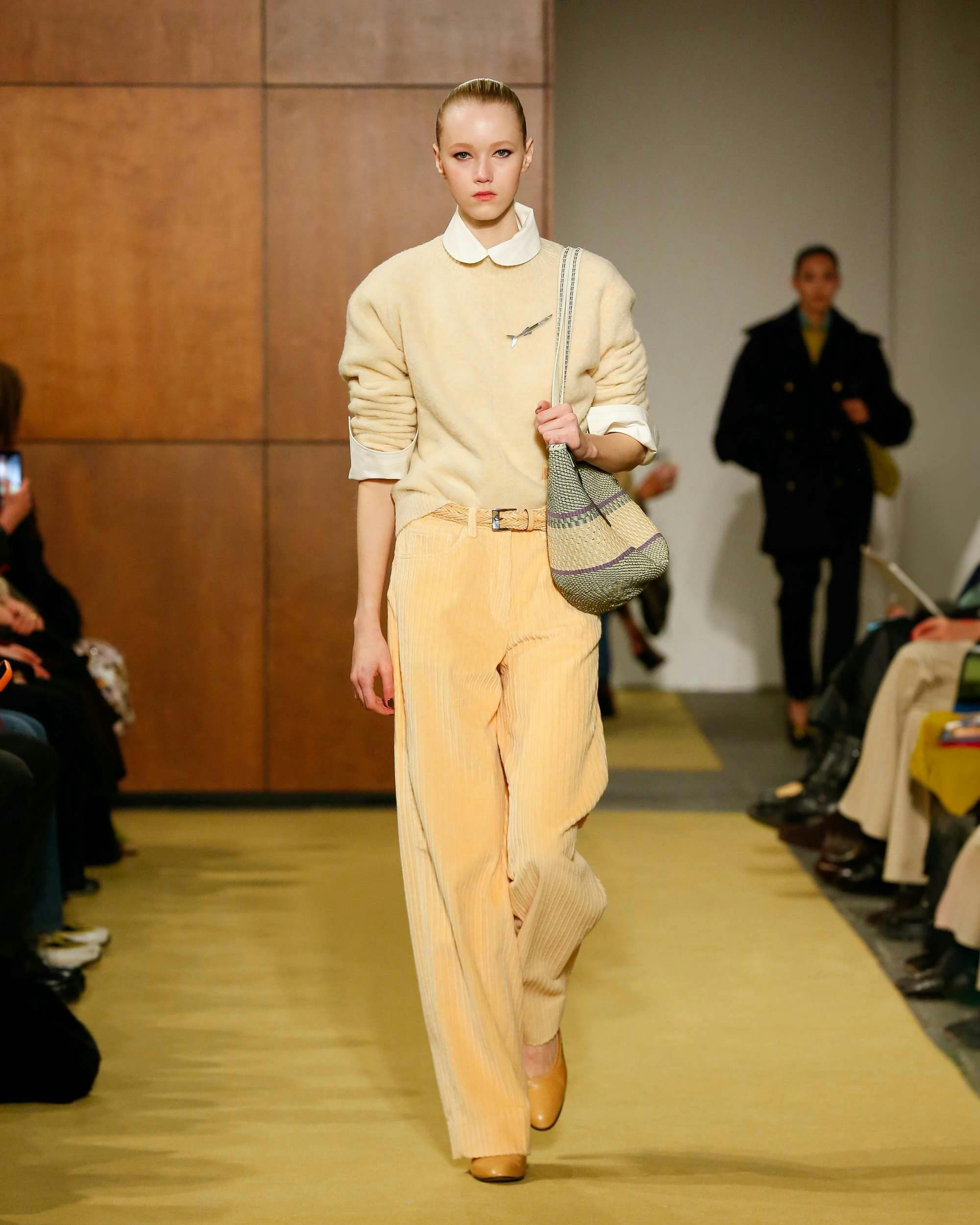 fashion handbag adult male man person female woman pants long sleeve