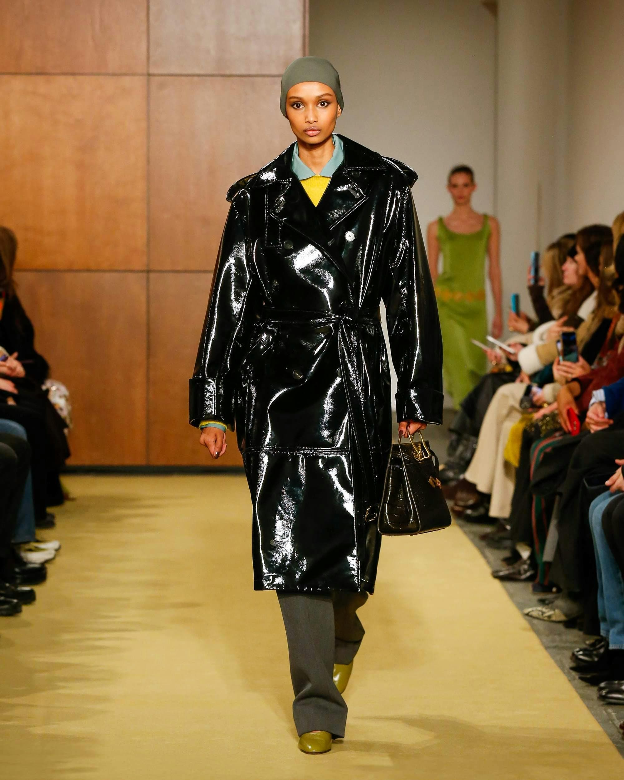 coat adult female person woman handbag male man shoe hat