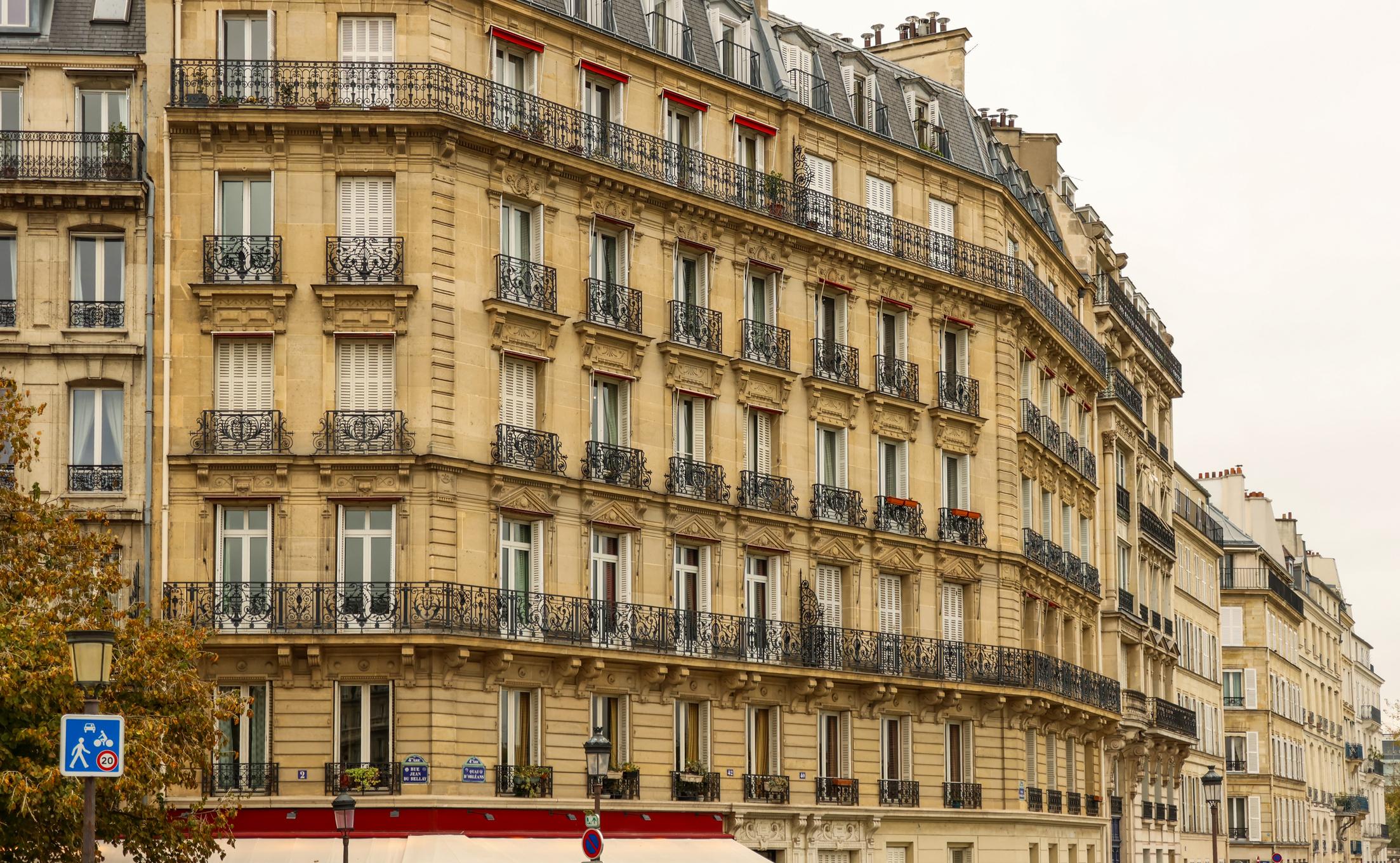 Classic Haussmann architecture in Paris, France, featuring historic residential buildings and ornate balconies