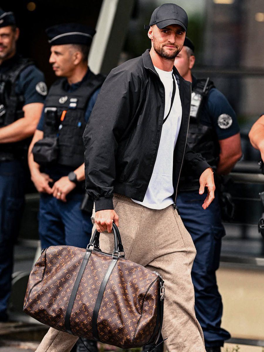 Image may contain Adrien Rabiot Accessories Bag Handbag Adult Person Clothing Hat and Coat