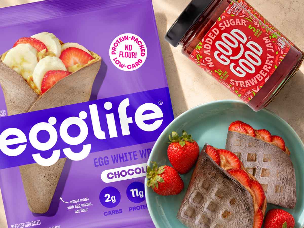 Strawberry chocolate waffle sandwich made with an egglife Chocolate wrap, protein cream cheese, GOOD GOOD strawberry jam and fresh strawberries.