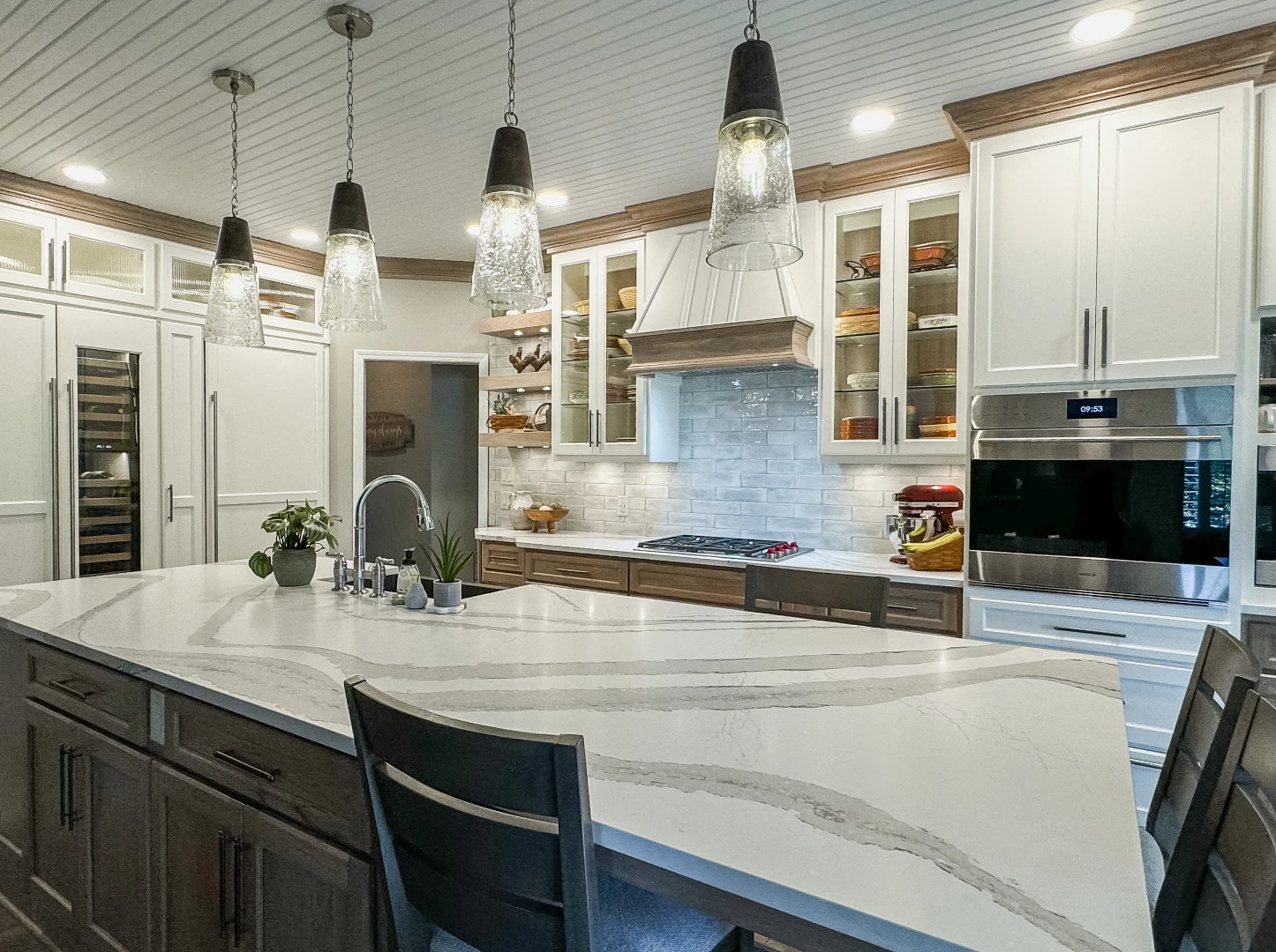 kitchen with white cabinets and white marble countertop