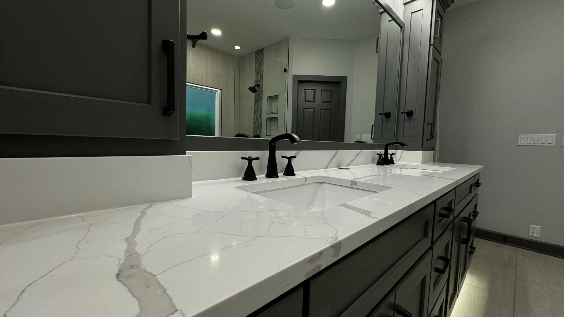 a new bathroom with a white marble countertop