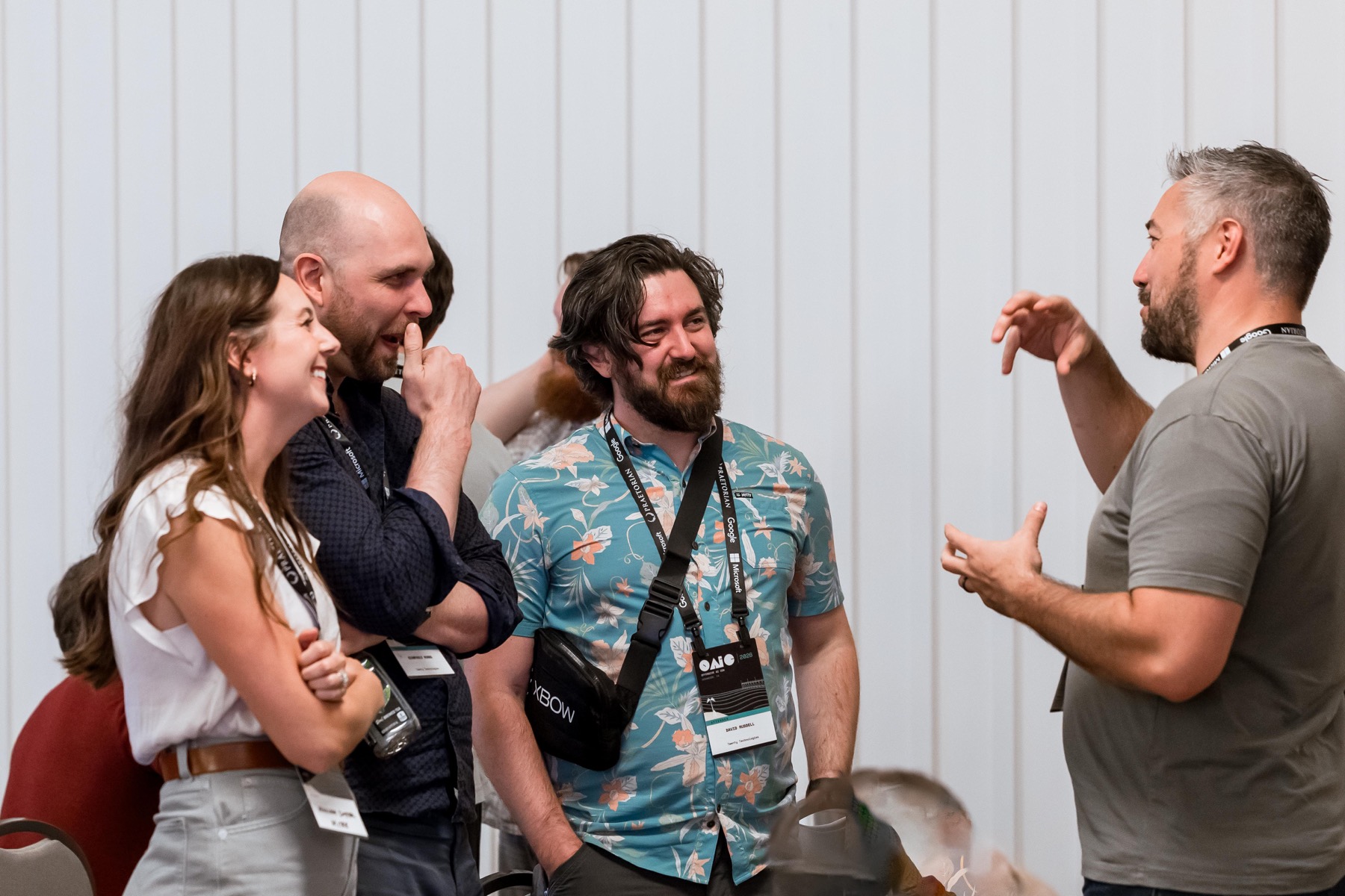 Attendees discussing research at OAIC 2026