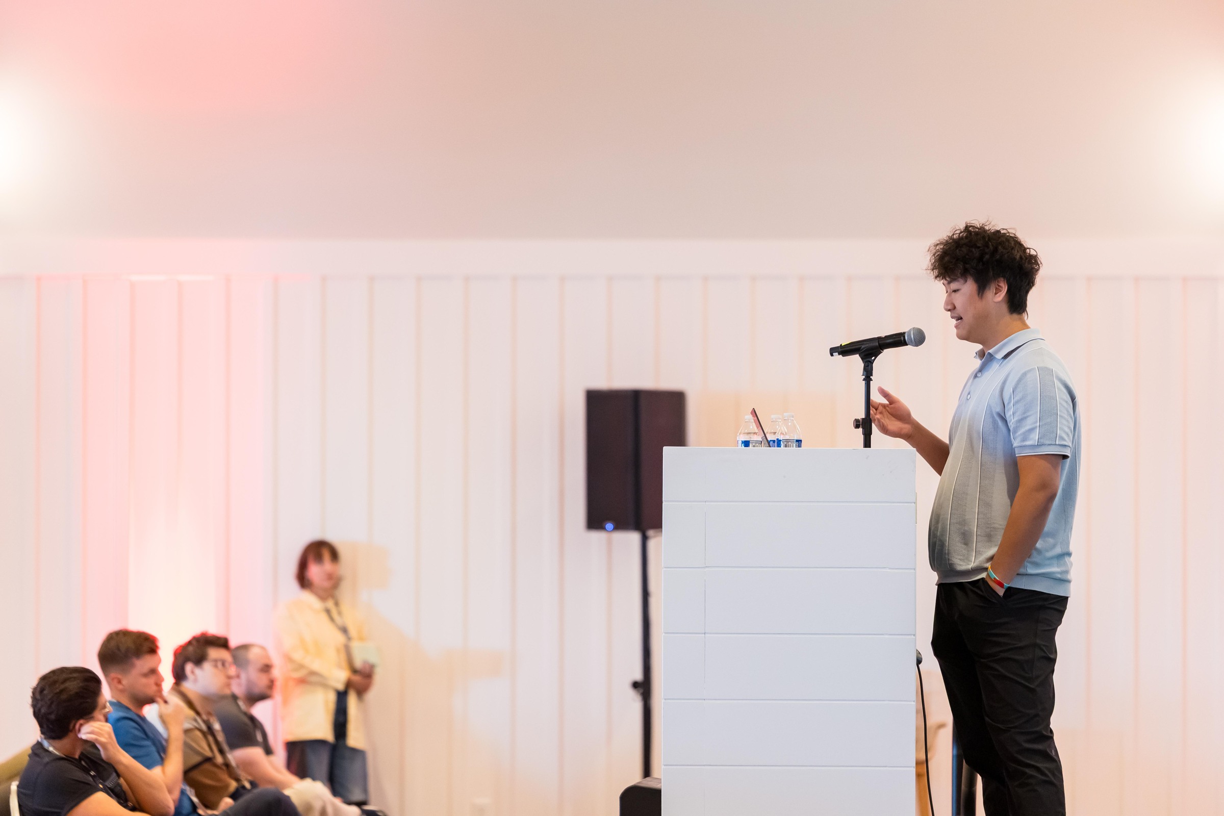 A speaker addressing the room during a Tuesday morning research session.