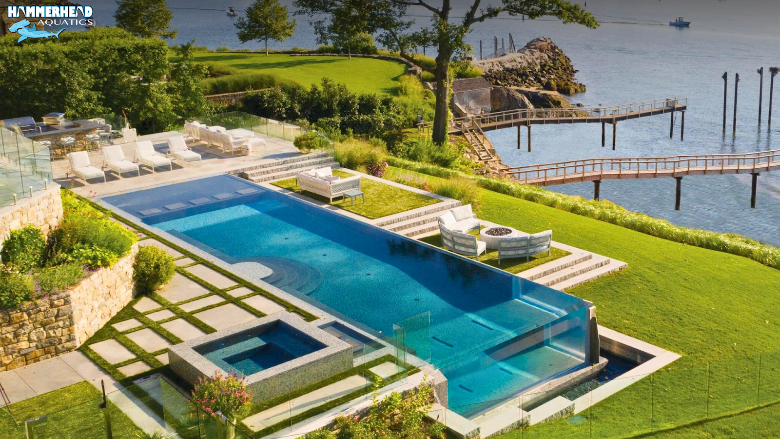 Luxury pool with a large acrylic window offering a crystal-clear underwater view.